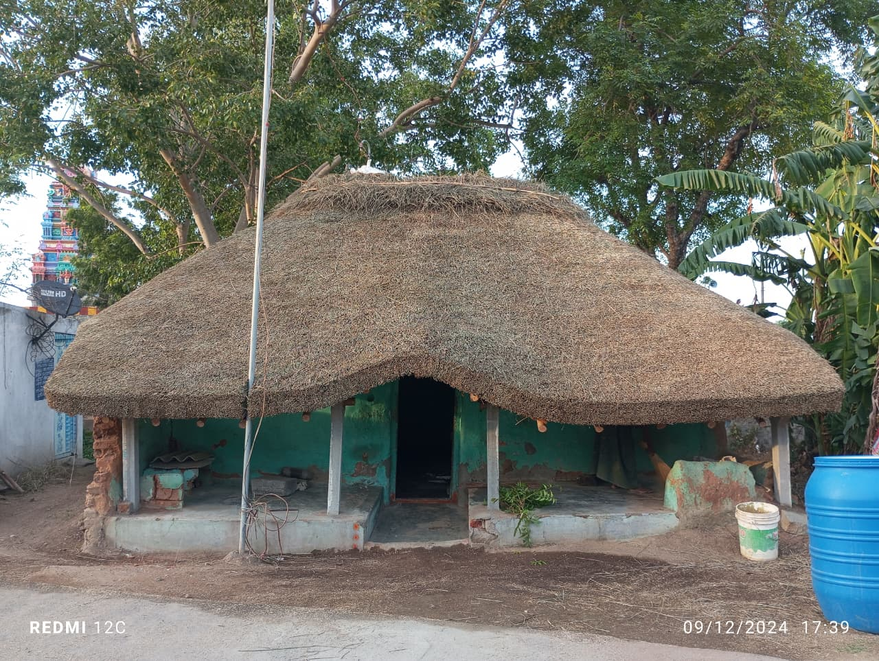 Farmhouse with a thatched roof and a wooden porch