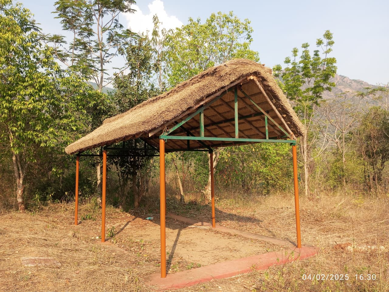 Thatched roof gazebo pavilion in a tropical garden