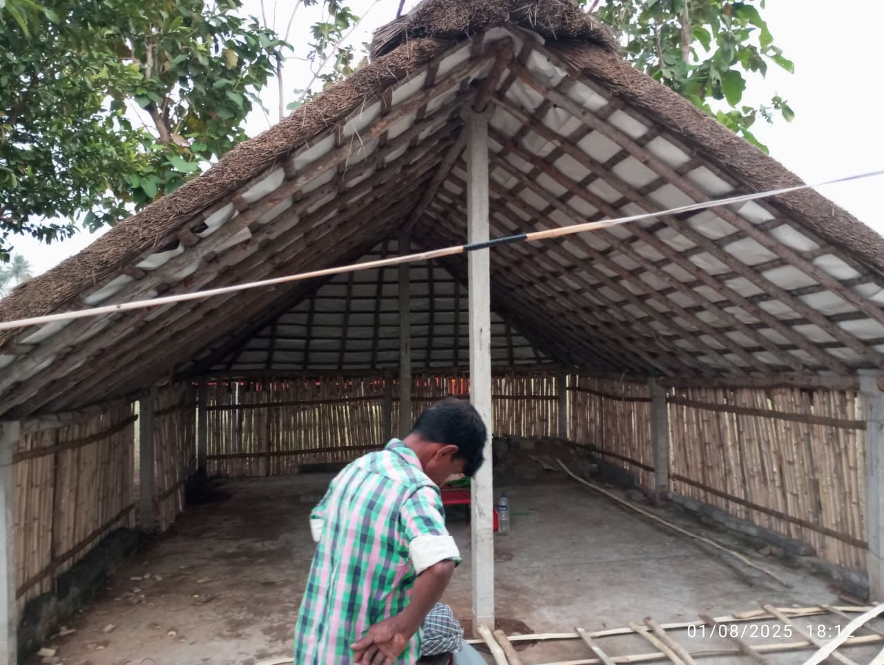 Traditional mud and clay wall of a rural hut under construction